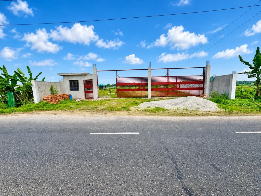 Mermaid Green City entrance gate photographed from the roadside
